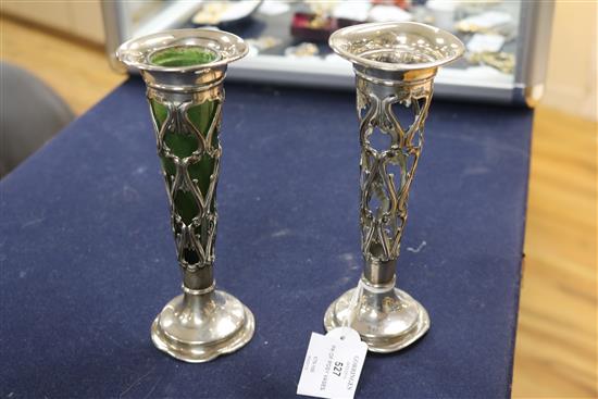 A pair of Edwardian Art Nouveau pierced silver posy vases with green glass liners, William Mammatt & Son, Sheffield, 1907, one glass a.